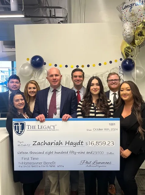 Team celebrating a client benefit award
